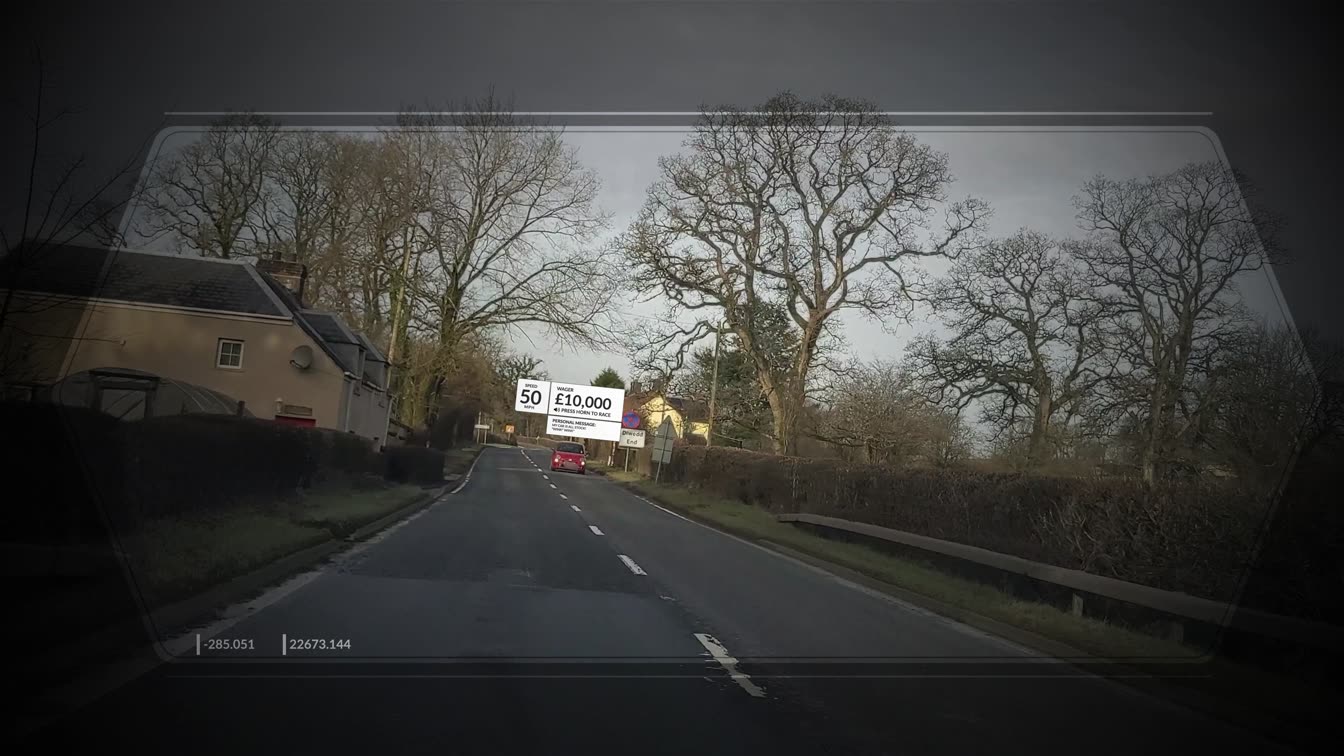 A driving view through a hexagonal augmented reality overlay showing telemetry figures