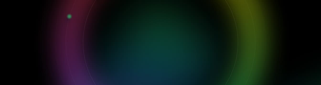 Soft coloured light orbiting on a dark field